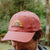 West Coast Seeds - A man wearing an Organic Cotton Hat  in a garden, made in canada
