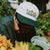 West Coast Seeds - A man wearing an Organic Cotton Hat  in a garden, made canada
