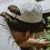 West Coast Seeds - A man wearing an Organic Cotton Hat  in a garden, made canada