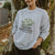 a girl wearing a sweatshirt from our swag collection outdoors